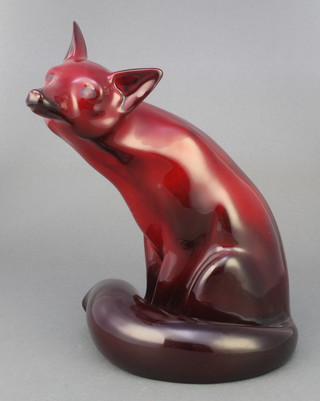 A Royal Doulton flambe Noke figure of a seated fox with original retailers label 10" 
