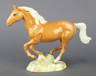 A Beswick figure of a galloping horse Palomino 1374, gloss 7 1/2"  