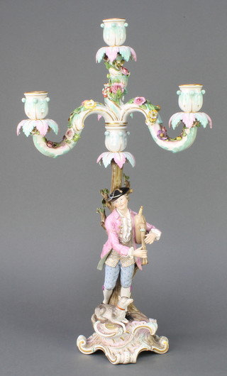 A Meissen candlestick, the 3 light upper section encrusted with flowers the base with a gentleman playing an instrument with dog 20"