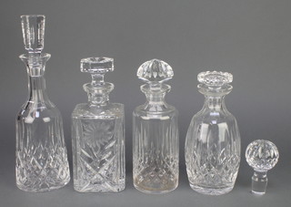 A square spirit decanter and stopper 10", 3 others together with a spare stopper