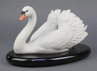 A Franklin Mint porcelain figure - The Royal Swan 12" on a wooden stand
