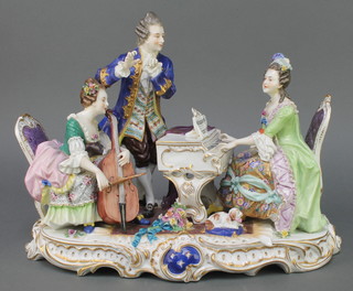 A 20th Century Italian conversation piece with 2 ladies and a gentleman seated around a piano with a dog at their feet on a Rococo base 12" 