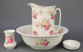 An Edwardian style wash stand set comprising jug, bowl, soap dish and vase 
