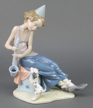 A Lladro figure of a clown with saxophone 5059 11", boxed 
