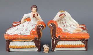 A pair of Staffordshire figures reclining on couches reading books and holding instruments 6 1/2" 