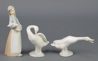 A Lladro figure of a young girl holding a goose, ditto holding a piglet 6 1/2"  2 Lladro figures of geese 3", a Nao ditto and 1 other figure  