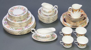 A Paragon Country Lane part dinner service comprising 8 small plates, 8 medium plates, 8 dinner plates, sauce boat and stand, milk jug and sugar bowl and 8 dessert bowls together with an Edwardian part tea set 