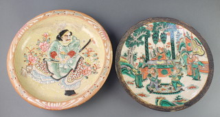 A Japanese crackle glazed charger decorated with figures in a pavilion garden 11", a late Satsuma dish decorated with a warrior 12" 