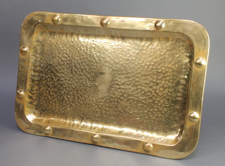 A rectangular Newlyn style brass tray with roundelled and planished decoration 15" x 23 1/2" 