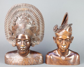 A pair of Balinese carved hardwood portrait busts of a lady 15" and gentleman 12" 