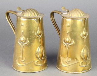 Joseph Sankey & Sons, a pair of Art Nouveau embossed brass lidded jugs of waisted form with stylised floral decoration, the bases marked L 1 1/2, 6" 
