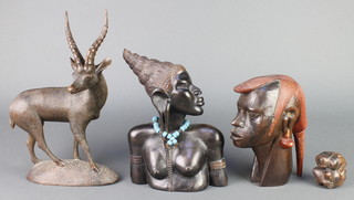An African carved ebony head and shoulders portrait bust of a lady 10", 1 other 8 1/2", carved wooden figure of a gazelle 13" and a carved wooden sculpture of a crouching gentleman 2 1/2"