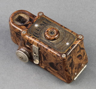 A Coronet midget camera in a brown Bakelite case 