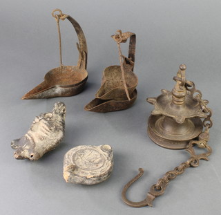 A curious circular Eastern bronze hanging oil lamp 4", 2 metal crusie lamps and 2 terracotta oil lamps 