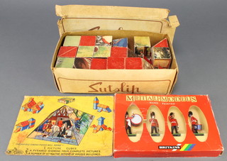 A child's 1930's pyramid shaped puzzle together with a set of Britains figures 2710