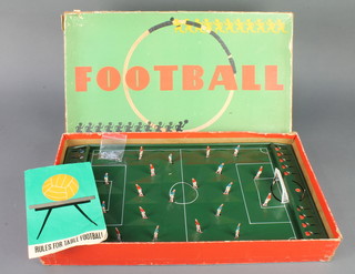 A Continental tin plate table top football game, boxed (some damage to box) together with a Waddingtons Formula 1 board game 