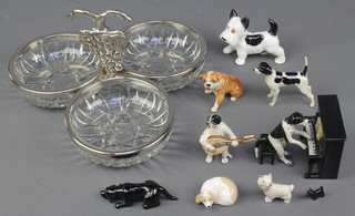 A modern porcelain group of a dog playing a piano and another playing a mandolin and minor porcelain figures of dogs and a 3 section plated dish