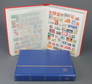 A red stockbook of mint and used World stamps and a ditto blue stock book 