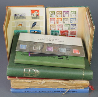 2 stock books of used World stamps, an Improved postage stamp album, a Shield postage stamp album, a Standard ditto and 1 other 