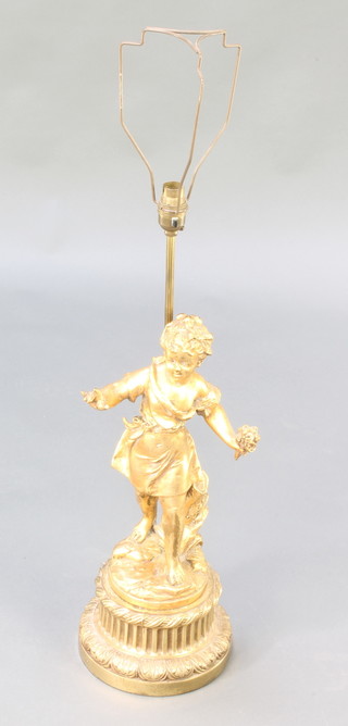 A gilt metal table lamp in the form of a standing cherub with garland 19"h 