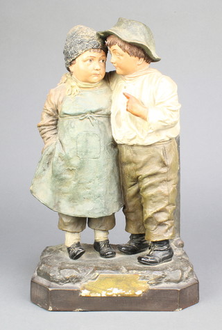 A Continental earthenware group of a boy and girl 12" 