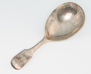 A Georgian IV silver caddy spoon of plain form with chased monogram London 1821