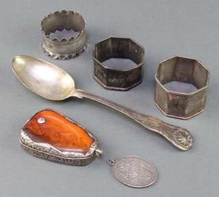 A Georgian silver Kings pattern dessert spoon London 1825, 3 napkin rings, a medallion and mounted pendant, weighable silver 125 grams 