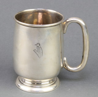 A silver mug with engraved woodpecker, Sheffield 1933, 185 grams