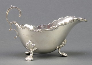 An Edwardian silver sauce boat with fancy rim and pad feet Birmingham 1910, 100 grams
