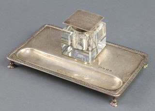 A silver ink stand with cut glass ink well, a silver lid with presentation inscription Birmingham 1926, 134 grams 6 1/4" x 3 3/4" 