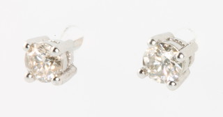 A pair of 18ct white gold single stone diamond ear studs, approx. 0.45ct