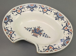 A 19th Century Delft shaving bowl with stylised floral motifs surrounding a basket of flowers 14" 