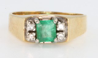 An 18ct yellow gold emerald and diamond ring, size Q