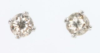 A pair of 18ct white gold champagne diamond ear studs, approx. 0.74ct
