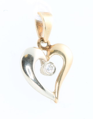 A 14ct 2 colour gold and diamond set heart shaped pendant