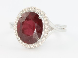 An 18ct Rhodolite and diamond cluster ring, size O 