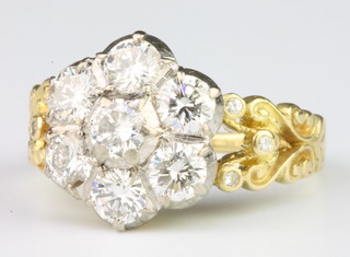 An 18ct yellow gold 7 stone diamond cluster ring approx. 1.5ct size O 1/2