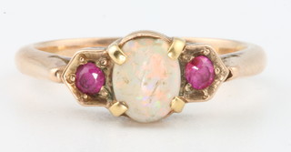 A yellow gold opal and garnet ring size I 1/2