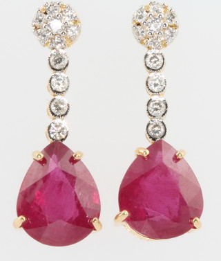 A pair of 18ct yellow gold diamond and pear cut rubies (treated) 
