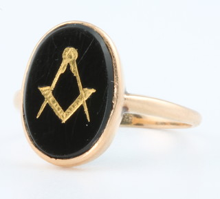 A gentleman's 9ct gold onyx Masonic ring, size M