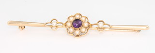 An Edwardian 15ct yellow gold amethyst and seed pearl bar brooch in a fitted case 