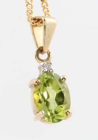 A 9ct yellow gold chain with peridot drop 