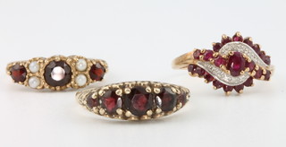 A 9ct ruby and diamond dress ring, a pearl and garnet 9ct ditto and a 9ct garnet set ring, sizes P, N and S