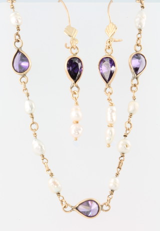 A 14ct yellow gold amethyst and baroque pearl bracelet with earrings