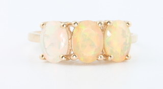 A 10ct yellow gold 3 stone opal ring size O 
