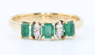 An 18ct yellow gold emerald and diamond 7 stone half hoop ring size Q 1/2
