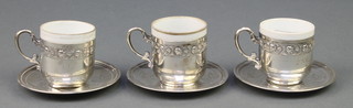 3 Arab silver coffee cups and saucers with porcelain liners