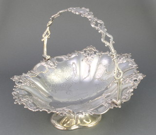 A Victorian cast and chased silver basket with swing handle and presentation inscription Birmingham 1874 12 1/2", 744 grams