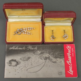 A pair of silver and pearl Mikimoto earrings and a ditto brooch boxed