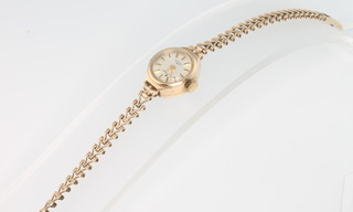 A lady's 9ct yellow gold Rotary wristwatch on a ditto bracelet, 7 grams